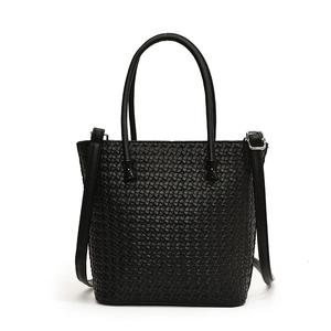Classic black woven tote bag featuring round handles and adjustable shoulder strap for women