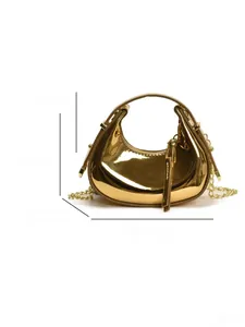 Detailed size specifications of the shiny gold crescent handbag with metallic chain strap