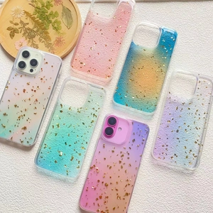 Detailed macro view of colorful gradient iPhone cases with elegant gold foil and glitter finish