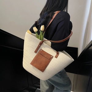 Large woven tote bag in beige cotton rope with brown faux leather straps and front pocket