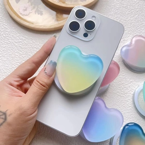 Macro detail of heart-shaped gradient resin phone grip with smooth jelly texture