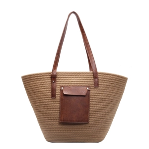 Minimalist large khaki woven tote bag with contrast brown faux leather pocket and handles