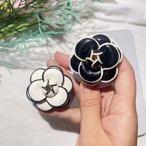 Elegant black and white camellia flower phone socket stands with electroplated alloy finish