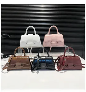 Five assorted colors of hourglass handbags featuring glossy pleated texture and belt buckles