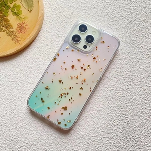 Close-up of iPhone case with pink-green gradient design and embedded gold foil glitter