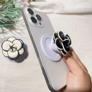3D camellia flower phone socket grip stand in black and white plated alloy design