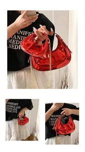 Detail of red patent leather crescent bags in large and mini sizes with gold chains