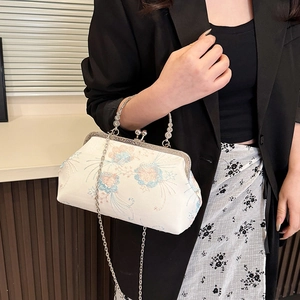 Elegant Chinese vintage embroidered crossbody bag with floral pattern and metal handle