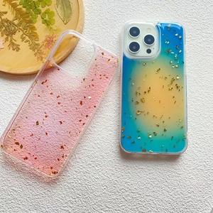 Artistic iPhone 16 Pro Max cases with gold foil glitter and colorful dye patterns