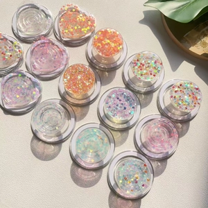 Detail of transparent Griptok with colorful heart-shaped sequins and glitter filling
