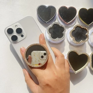 Luxurious crystal square mirror phone grip with magnetic base on a white smartphone