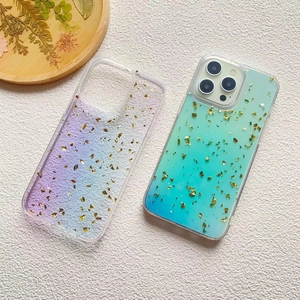 Detail of gradient phone case with embedded gold foil flakes for iPhone 16 Pro Max