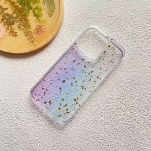 Detail of gradient purple phone case with embedded gold foil flakes for iPhone 16 Pro Max