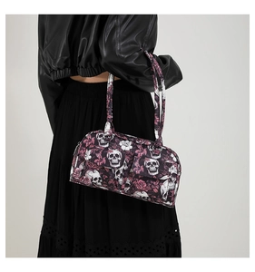 Close-up of gothic skull and rose floral print on high-quality fabric shoulder bag