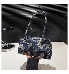 Gothic shoulder bag with skull and dark rose print featuring dual front flap pockets