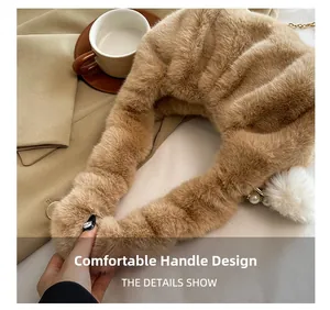 Detailed view of plush brown faux fur handbag with pearl and pompom charm decoration