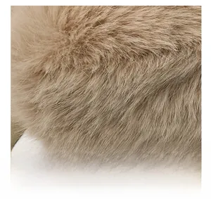Macro shot of fluffy light brown plush texture and fine faux fur material detail