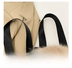 Detailed shot of comfortable black nylon shoulder straps on a plush faux fur handbag