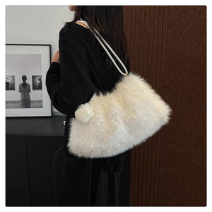 Detail of white faux fur tote bag with plush fluffy texture and dual slim shoulder straps