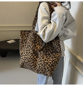 Detail of leopard print canvas tote bag showing large capacity and soft texture