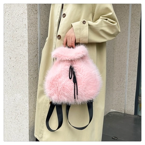 Detail showing the fluffy texture of the pink faux fur drawstring backpack for women