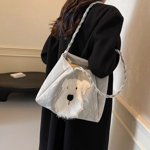 Minimalist grey hobo bag with schnauzer dog plush patch and woven shoulder strap