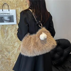 Faux fur tote bag in light brown with plush pompom charm and leather straps