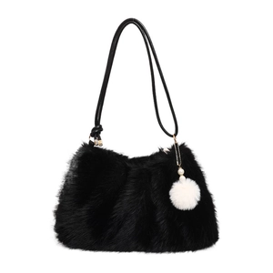 Fluffy black faux fur shoulder bag with pearl charm and pompom on white background