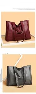 Detail view of large tote bags in burgundy and grey soft leather with pebbled texture