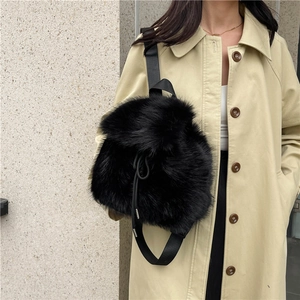 Stylish black faux fur drawstring backpack with wide nylon strap for winter fashion