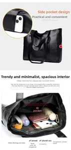 Detailed view of spacious black tote bag interior showing pockets and daily essentials