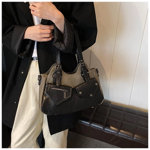 Detail of vintage tote bag featuring contrast stitching and multi-pocket structure