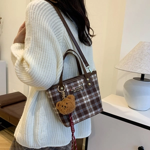 Plaid canvas shoulder bag with brown leather strap and cute bear charm pendant