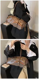 Detail of vintage brown leather baguette bag with a detachable round coin purse