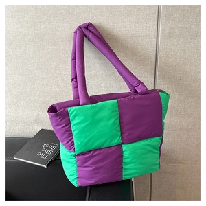 Close-up of quilted tote bag with purple and green checkerboard pattern detail