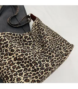 Detail of leopard print tote bag texture and high-quality canvas material close-up