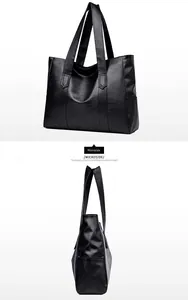 Detailed side view of black pebble grain PU leather tote bag with sturdy handles