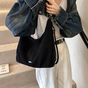 Black minimalist Hobo tote bag with adjustable strap and silver metal detail
