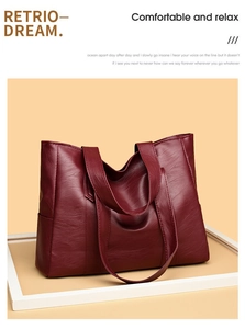 Close-up of wine red PU leather tote bag with lychee grain texture and stitching