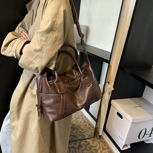 Vintage dark brown wax leather tote bag with dual handles and adjustable shoulder strap