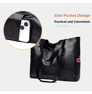 Detail shot of the side pocket on a black PU leather tote bag holding a smartphone