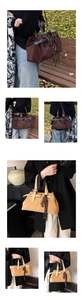 Detail of matte suede tote bags with leather belt buckle straps and decorative woven rope