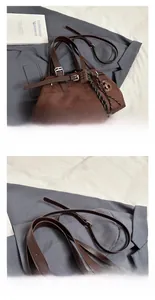 Detail of dark brown matte tote with leather handles and braided rope charm accessory