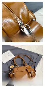 Close-up of vintage brown PU leather handbag with multi-pockets and silver hardware