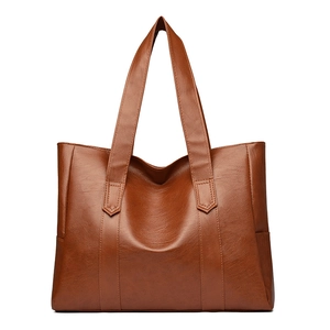 Minimalist large brown PU leather tote bag with dual handles on white background
