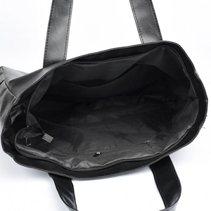 Minimalist black PU leather tote bag with spacious interior and zipper closure