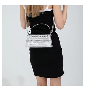 Glossy silver croc-embossed handbag with metallic finish and slim shoulder strap