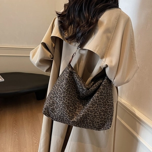 Retro leopard print tote bag styled with a khaki trench coat for a trendy autumn look