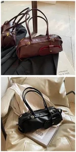 Detail of long baguette bags in burgundy and black with decorative metal buckle and charms