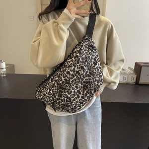 Leopard print canvas crossbody chest bag with adjustable wide black shoulder strap